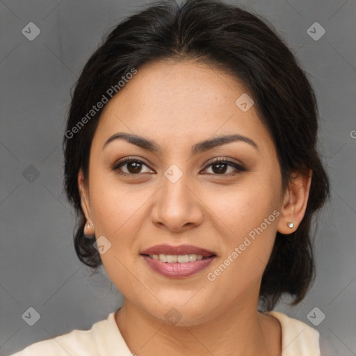 Joyful asian adult female with medium  brown hair and brown eyes