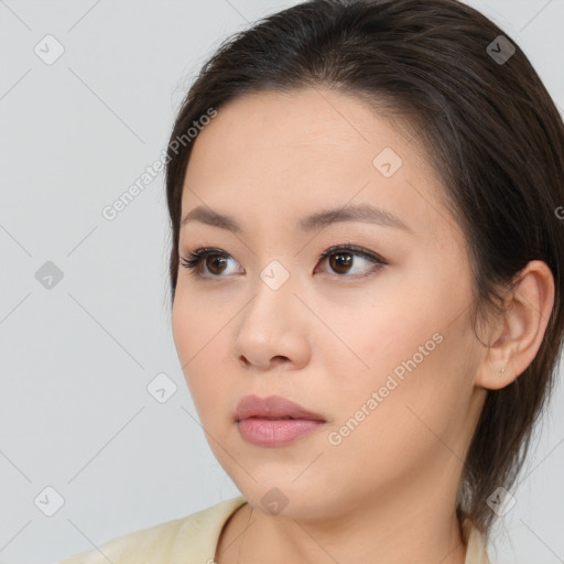 Neutral white young-adult female with long  brown hair and brown eyes