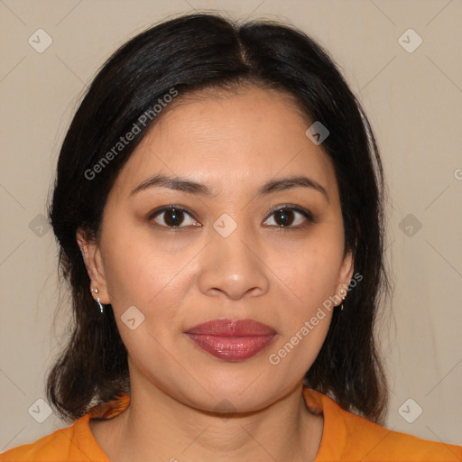 Joyful latino young-adult female with medium  brown hair and brown eyes