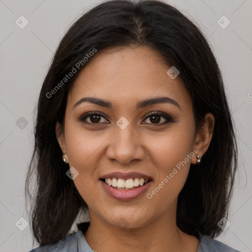 Joyful latino young-adult female with long  brown hair and brown eyes