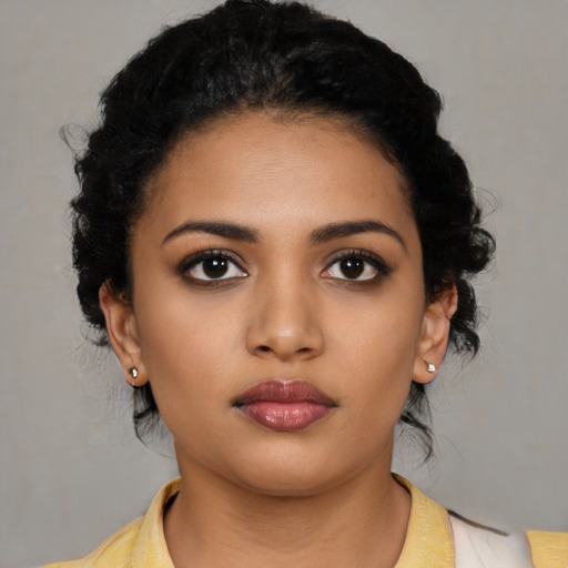 Neutral latino young-adult female with medium  black hair and brown eyes