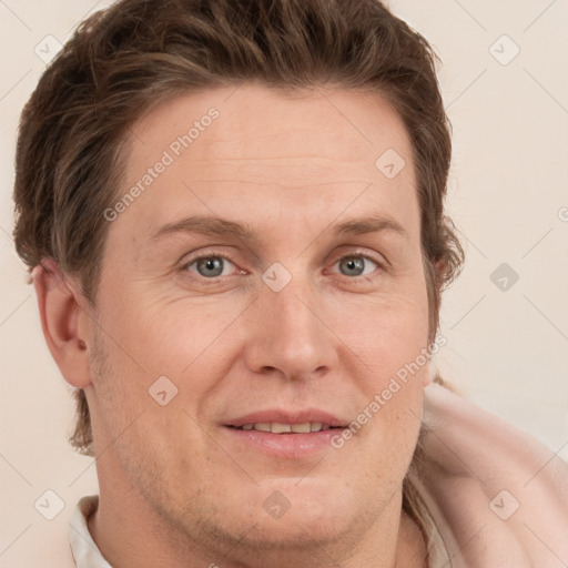 Joyful white adult male with short  brown hair and grey eyes