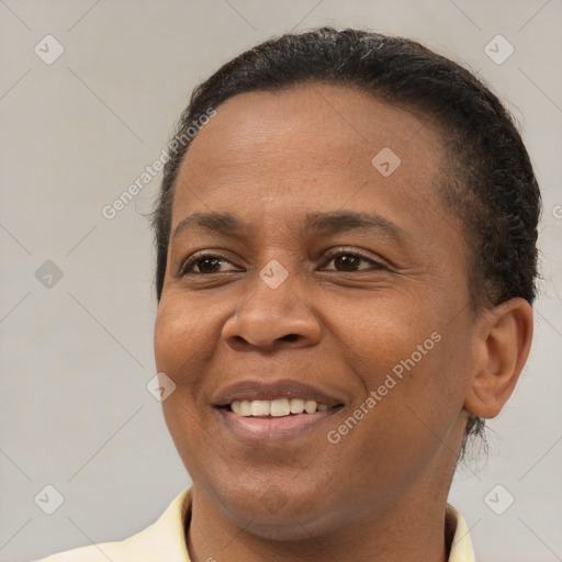 Joyful latino adult female with short  brown hair and brown eyes