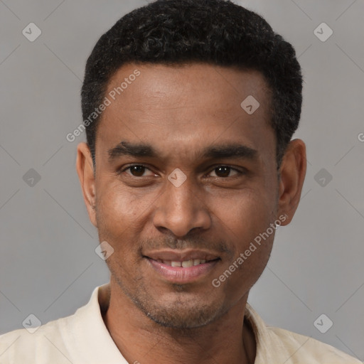 Joyful black young-adult male with short  black hair and brown eyes
