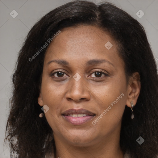 Joyful black adult female with long  brown hair and brown eyes