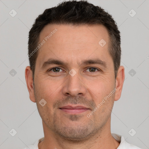 Joyful white adult male with short  brown hair and brown eyes