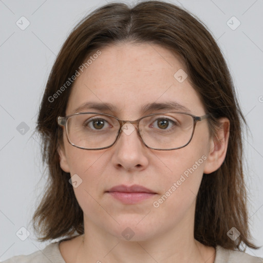 Joyful white adult female with medium  brown hair and grey eyes