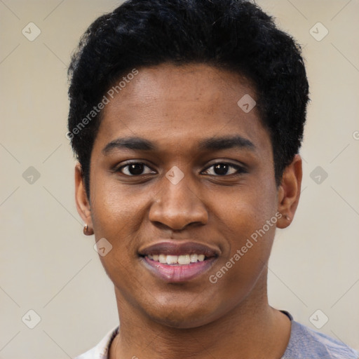 Joyful black young-adult male with short  black hair and brown eyes