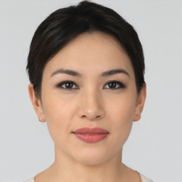 Joyful asian young-adult female with short  black hair and brown eyes