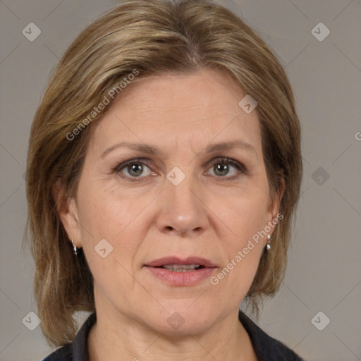 Joyful white adult female with medium  brown hair and grey eyes