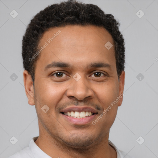 Joyful latino young-adult male with short  brown hair and brown eyes