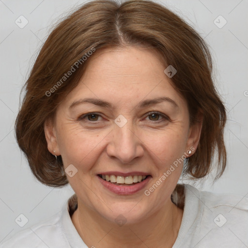 Joyful white adult female with medium  brown hair and brown eyes