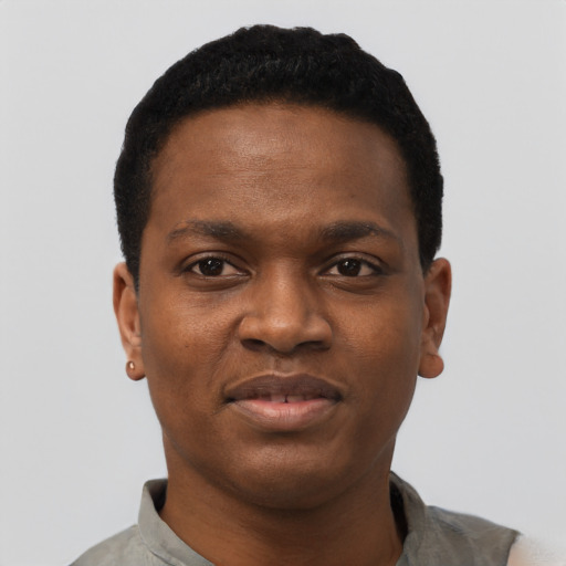 Joyful black young-adult male with short  black hair and brown eyes