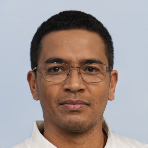 Neutral black adult male with short  black hair and brown eyes