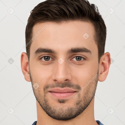 Joyful white young-adult male with short  brown hair and brown eyes