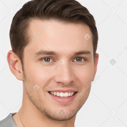 Joyful white young-adult male with short  brown hair and grey eyes