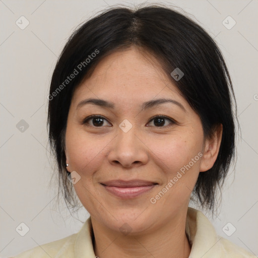 Joyful asian adult female with medium  brown hair and brown eyes