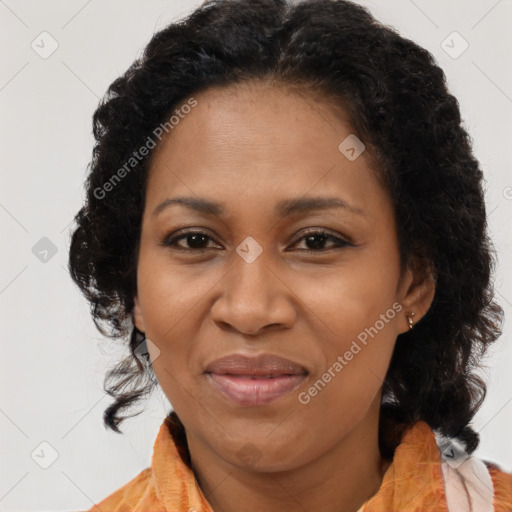 Joyful black adult female with medium  brown hair and brown eyes