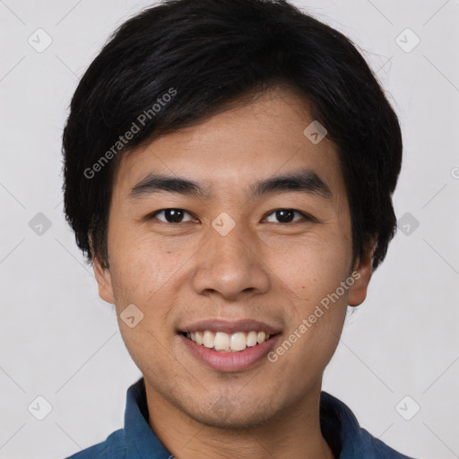 Joyful asian young-adult male with short  black hair and brown eyes