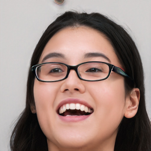 Joyful white young-adult female with long  black hair and brown eyes