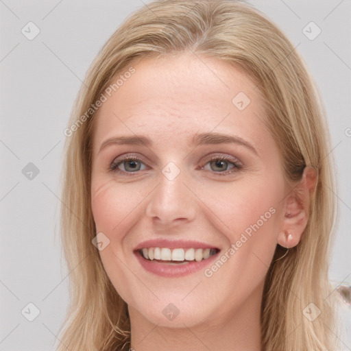 Joyful white young-adult female with long  brown hair and blue eyes