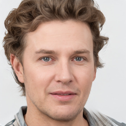 Joyful white adult male with short  brown hair and grey eyes