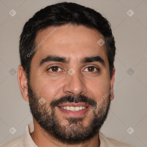 Joyful white adult male with short  black hair and brown eyes