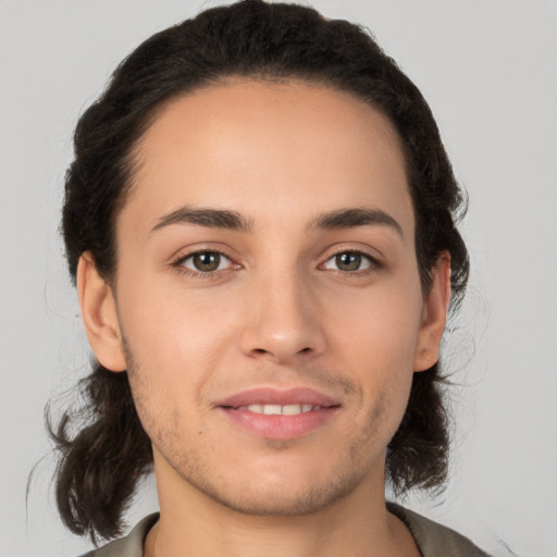 Joyful white young-adult male with medium  brown hair and brown eyes