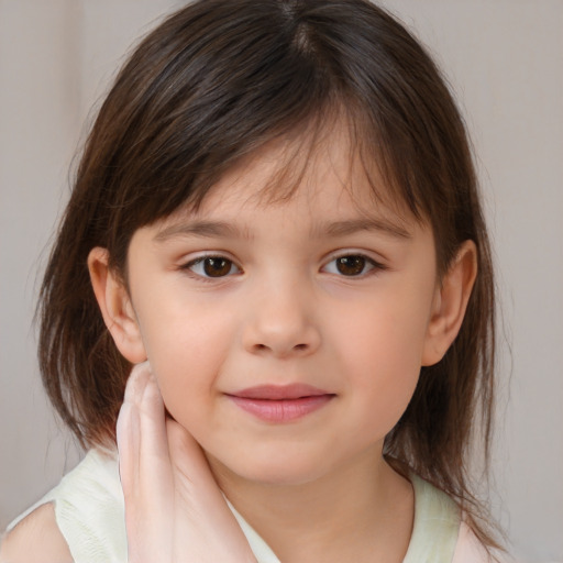 Joyful white child female with medium  brown hair and brown eyes