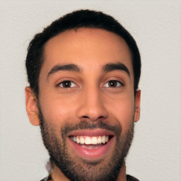 Joyful white young-adult male with short  black hair and brown eyes