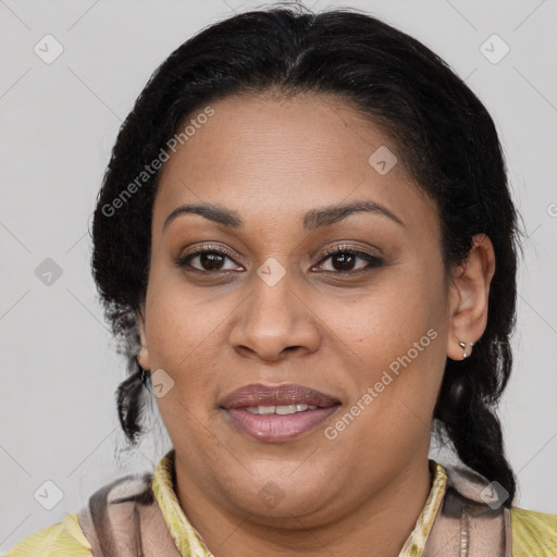 Joyful latino adult female with medium  brown hair and brown eyes