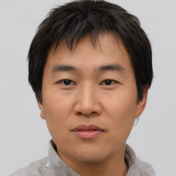 Neutral asian young-adult male with short  brown hair and brown eyes