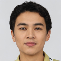 Joyful asian young-adult male with short  black hair and brown eyes