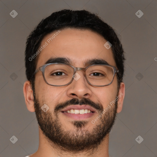 Joyful latino young-adult male with short  brown hair and brown eyes