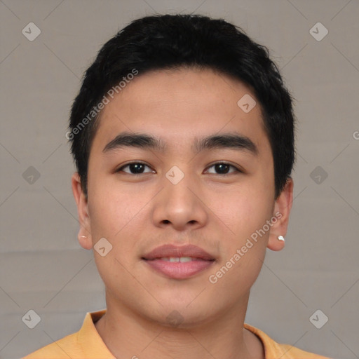 Joyful asian young-adult male with short  black hair and brown eyes