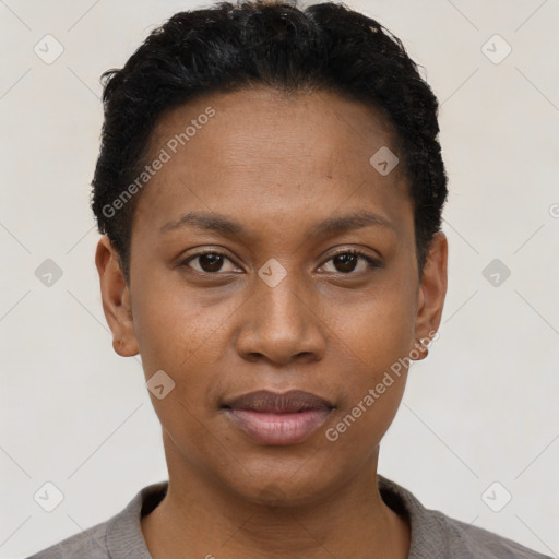 Joyful black young-adult female with short  black hair and brown eyes