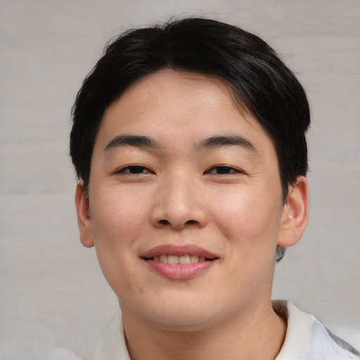 Joyful asian young-adult female with short  brown hair and brown eyes