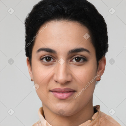 Joyful latino young-adult female with short  black hair and brown eyes