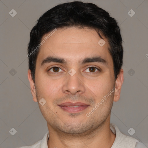 Joyful white young-adult male with short  black hair and brown eyes