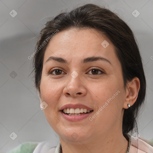 Joyful white adult female with medium  brown hair and brown eyes