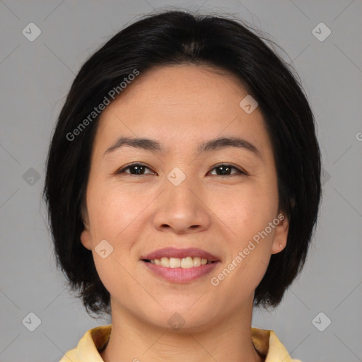 Joyful asian young-adult female with medium  brown hair and brown eyes