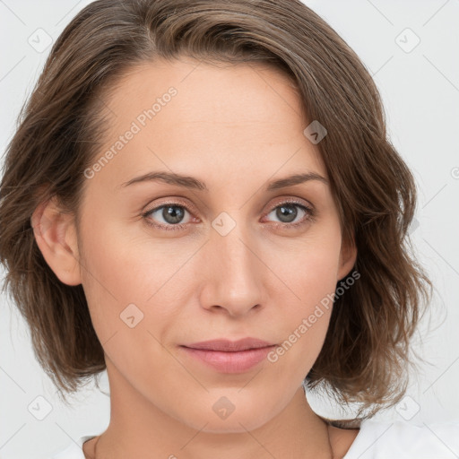 Joyful white young-adult female with medium  brown hair and green eyes