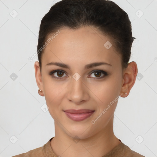 Joyful latino young-adult female with short  brown hair and brown eyes