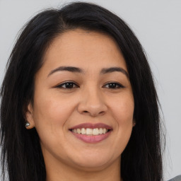 Joyful asian young-adult female with long  brown hair and brown eyes