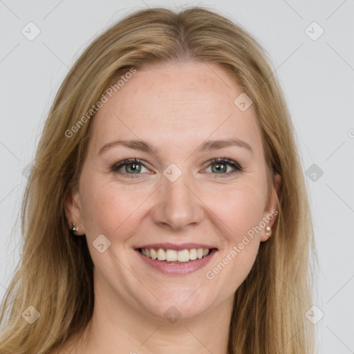 Joyful white young-adult female with long  brown hair and grey eyes