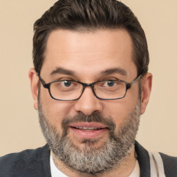 Joyful white adult male with short  brown hair and brown eyes