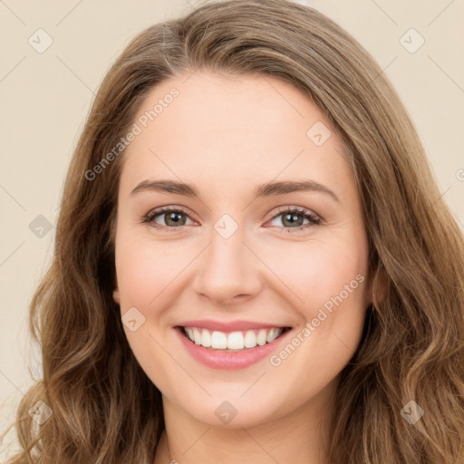 Joyful white young-adult female with long  brown hair and green eyes