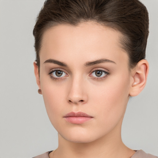 Neutral white young-adult female with short  brown hair and brown eyes