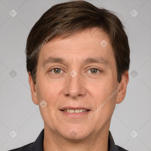 Joyful white adult male with short  brown hair and brown eyes