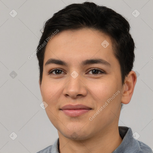 Joyful latino young-adult male with short  brown hair and brown eyes